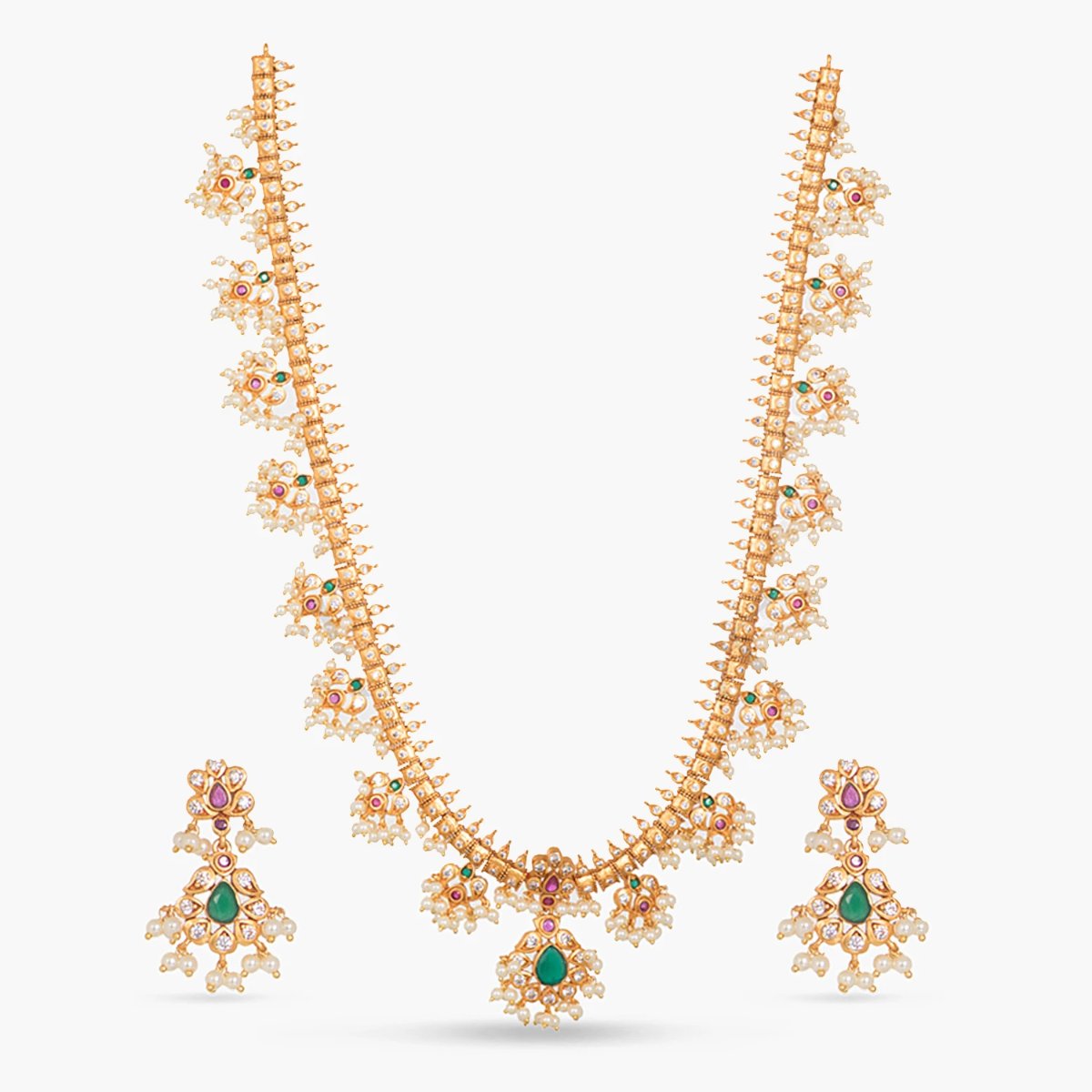 A picture of an Indian artificial necklace set in gold tone, featuring mango-shaped pearls and green teardrop beads with earrings.