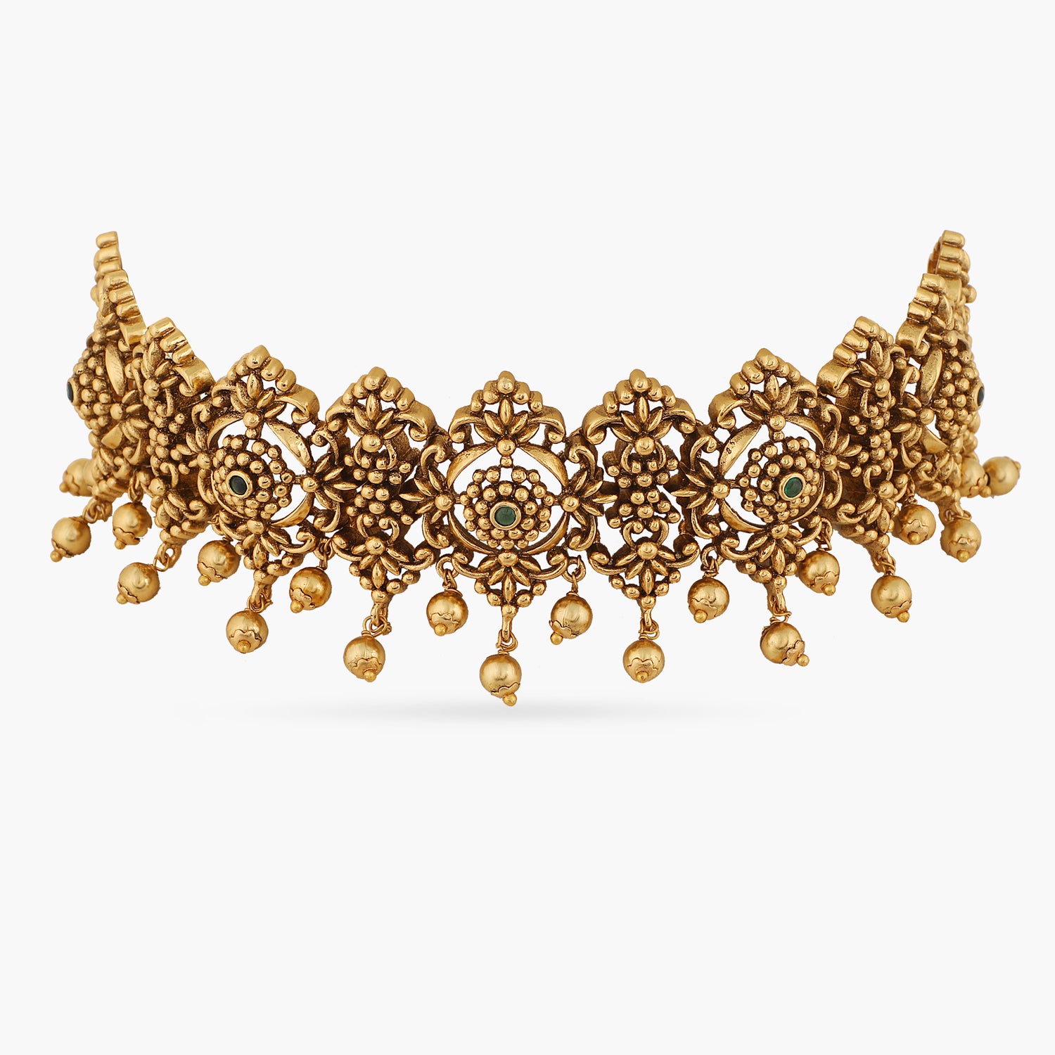 A picture of an Indian antique gold plated choker necklace with carved green gemstones.