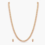 A picture of Indian artificial emerald and ruby jewelry set. It includes a necklace with emerald and ruby gemstones and matching earrings.