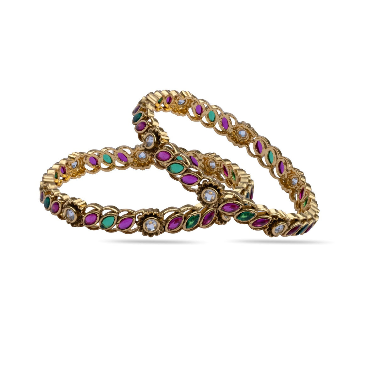 Close-up photo of a woman's hand holding a gold plated bangle with colorful gemstones.