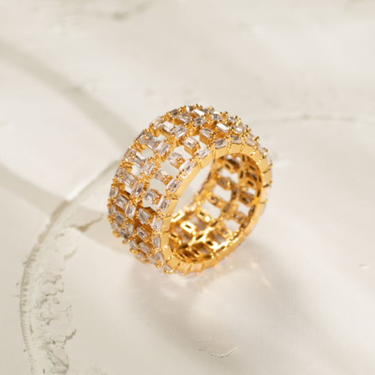 Baguette CZ Band Ring placed on a off white background