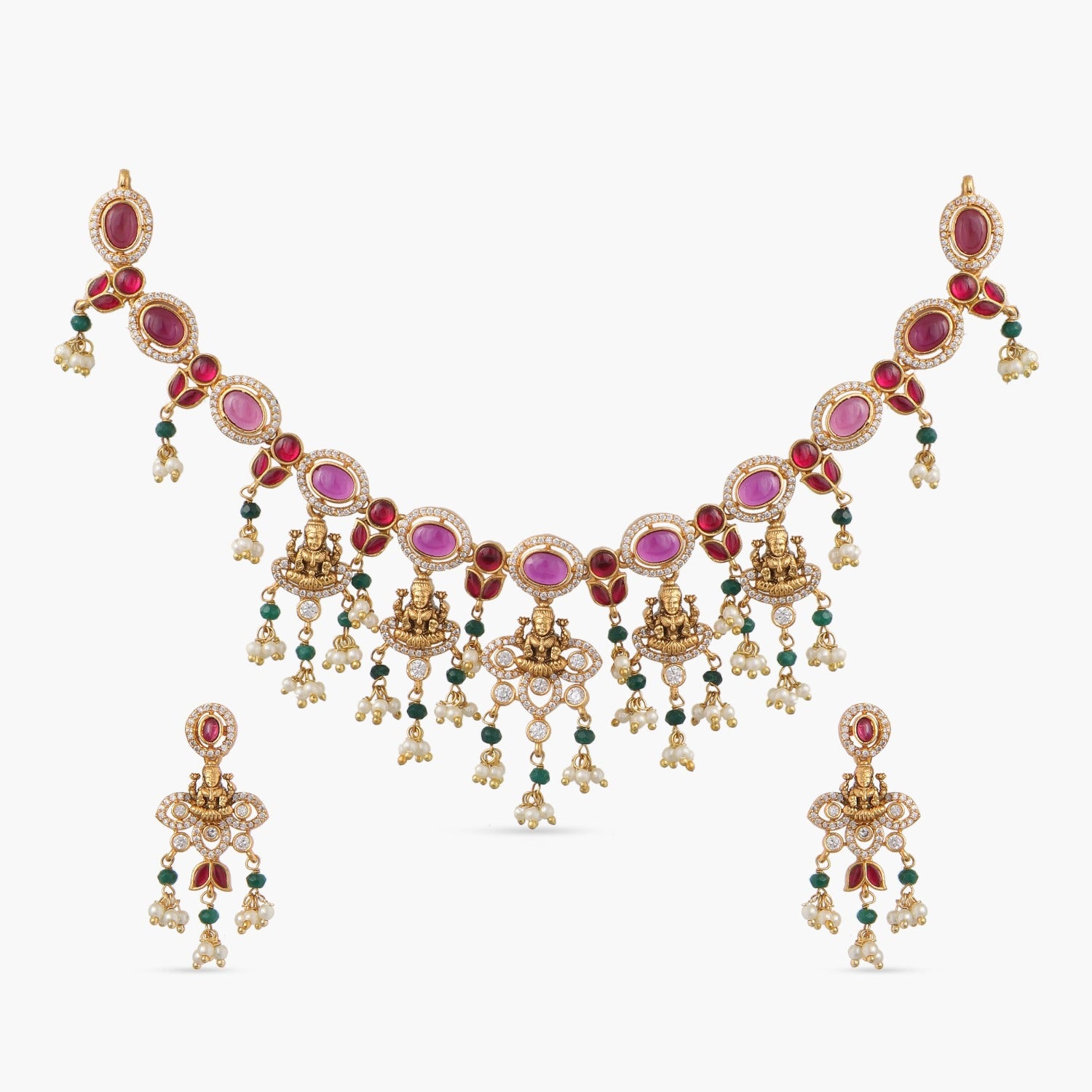 A picture of an Indian artificial gold plated necklace set with red and green gemstones, featuring five pendants with Goddess Laxmi idols