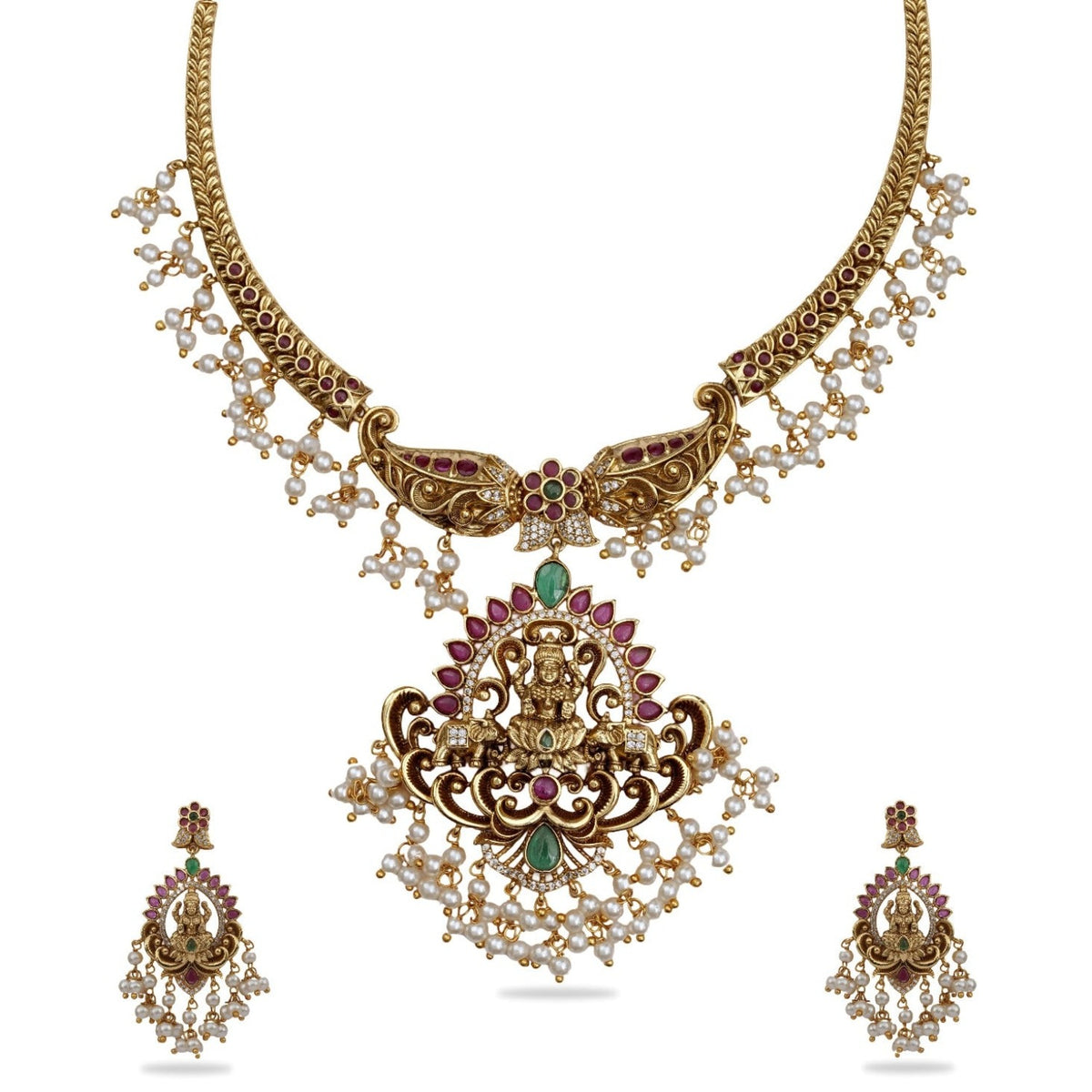 An image of a temple necklace set, featuring goddess Laxmi idols, adorned with white beads and red - green gemstones.