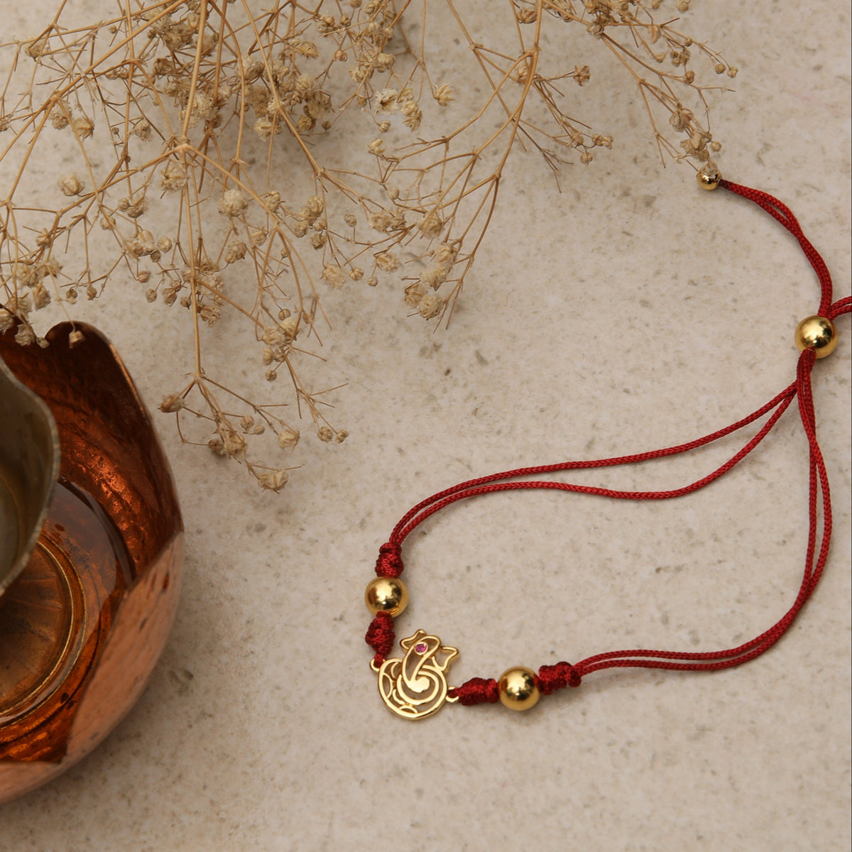 Shree Ganesha Gold Plated Silver Rakhi