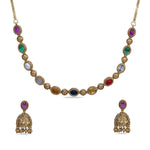 A close up image of an antique plated necklace set with navaratna gemstones.