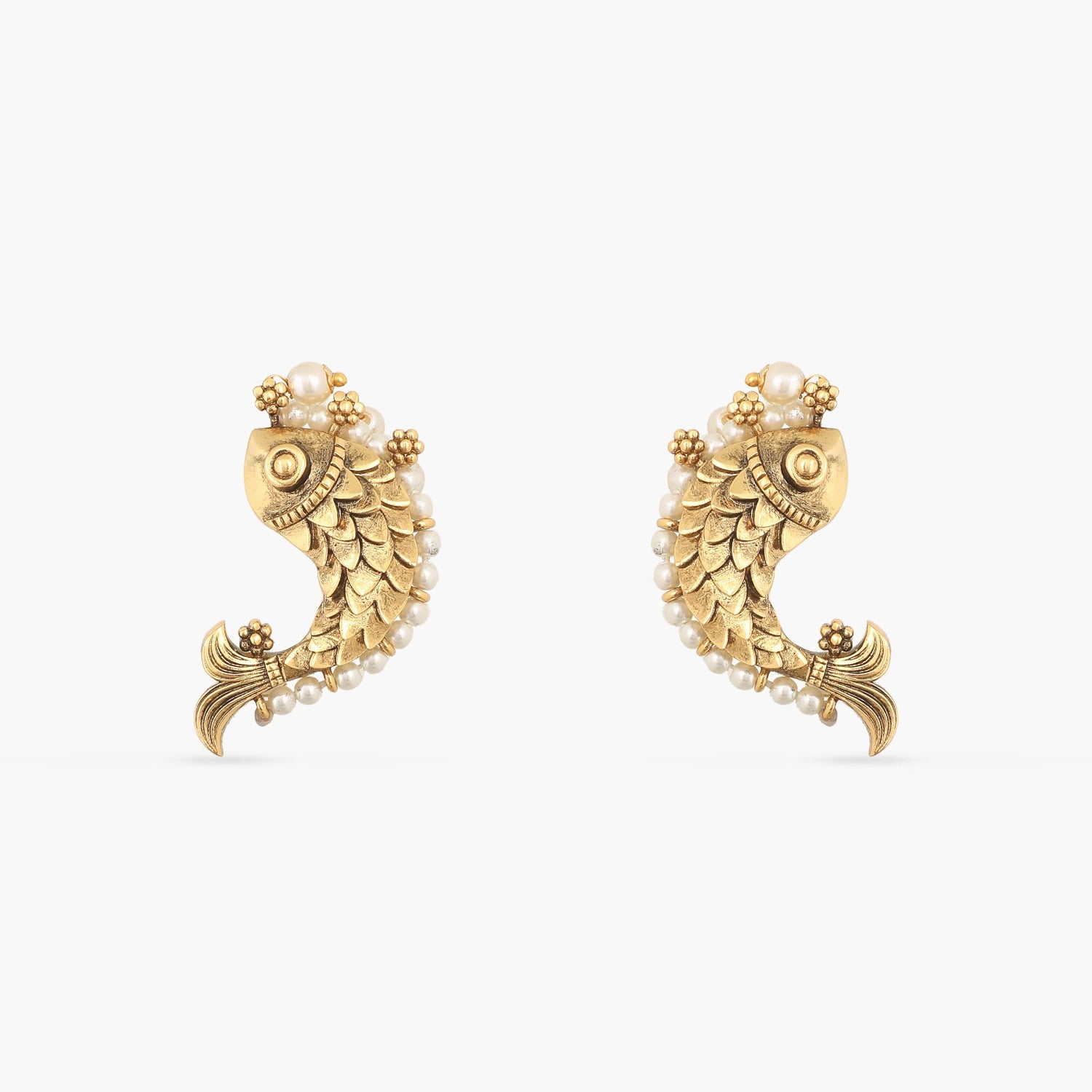 A picture of a pair Indian artificial earrings in fish patterns with pearls.