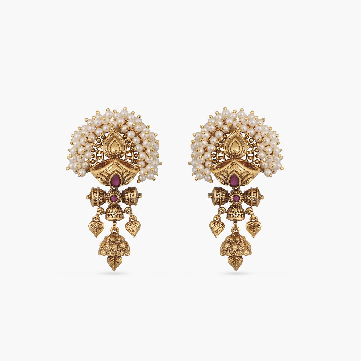 A picture of a pair of Indian antique gold plated earrings with a red gem and pearl details.