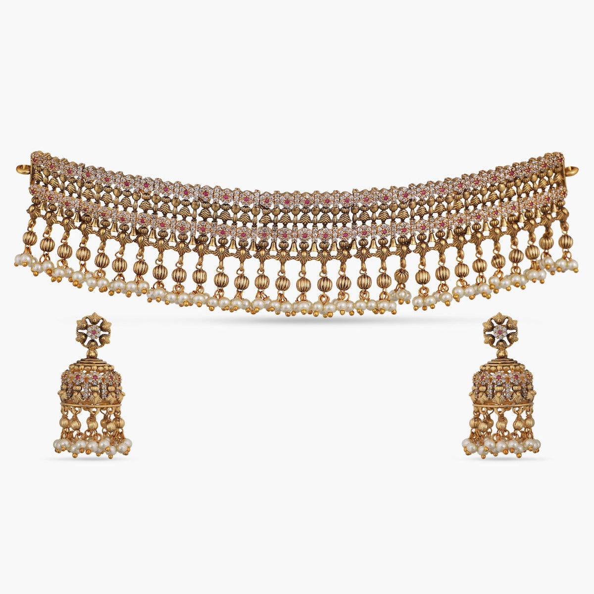 An image of Pearl choker necklace and stud earrings set on brown fabric