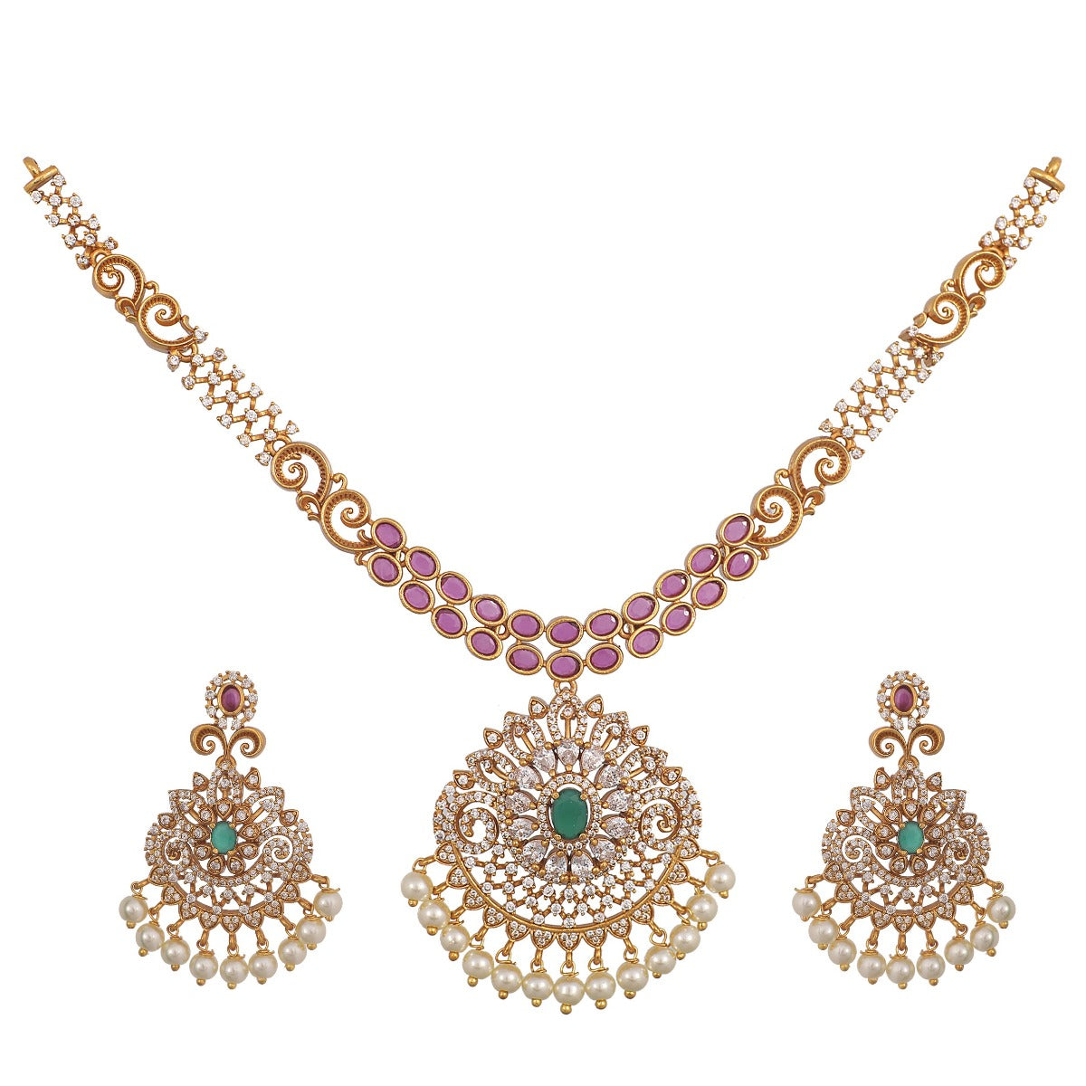A picture of an Indian artificial necklace and earring set in gold tone, featuring intricate filigree work  with Cubic Zirconia and pearl embellishments, green gemstones.