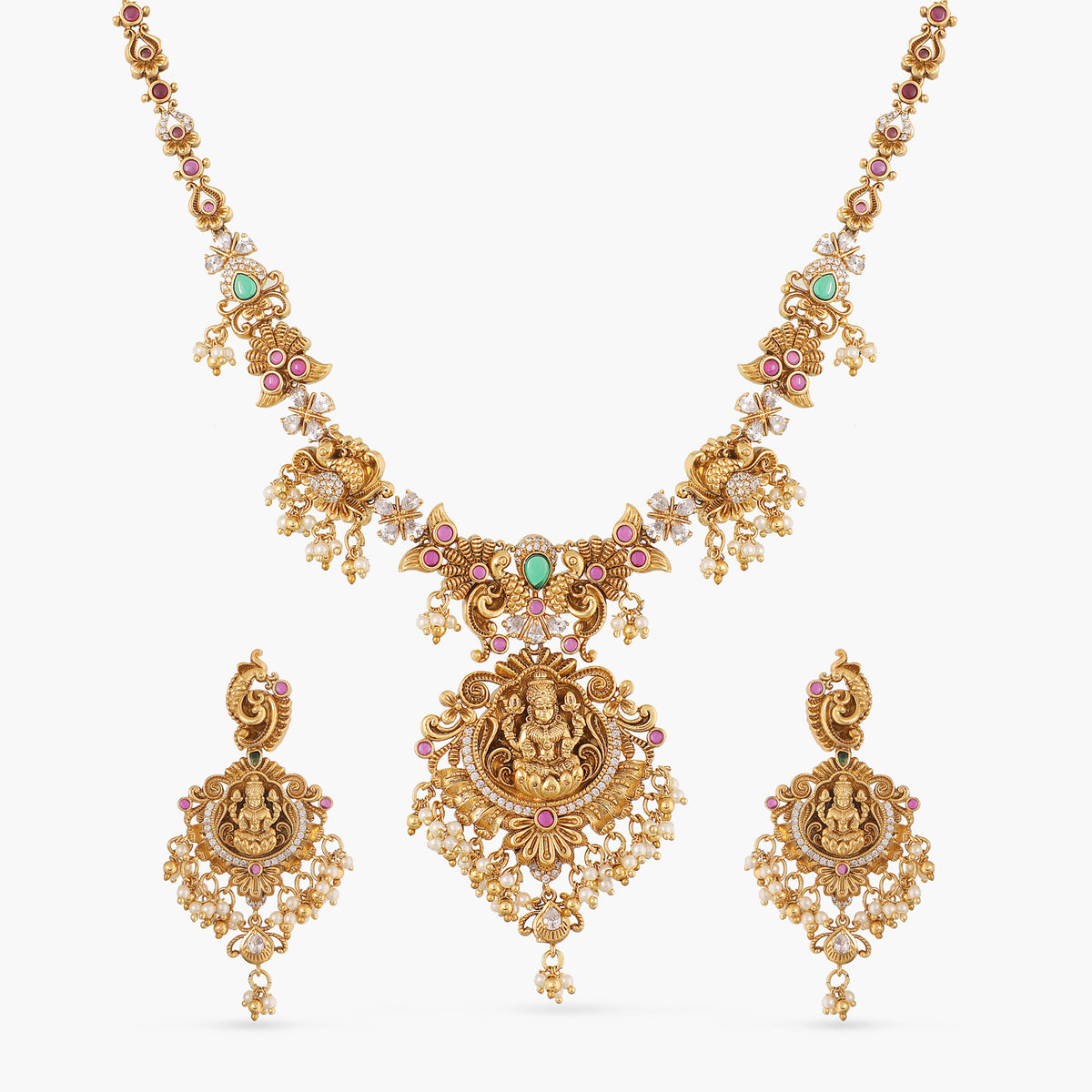 A picture of an Indian antique gold plated necklace with goddess Laxmi, featuring red and green gemstones.