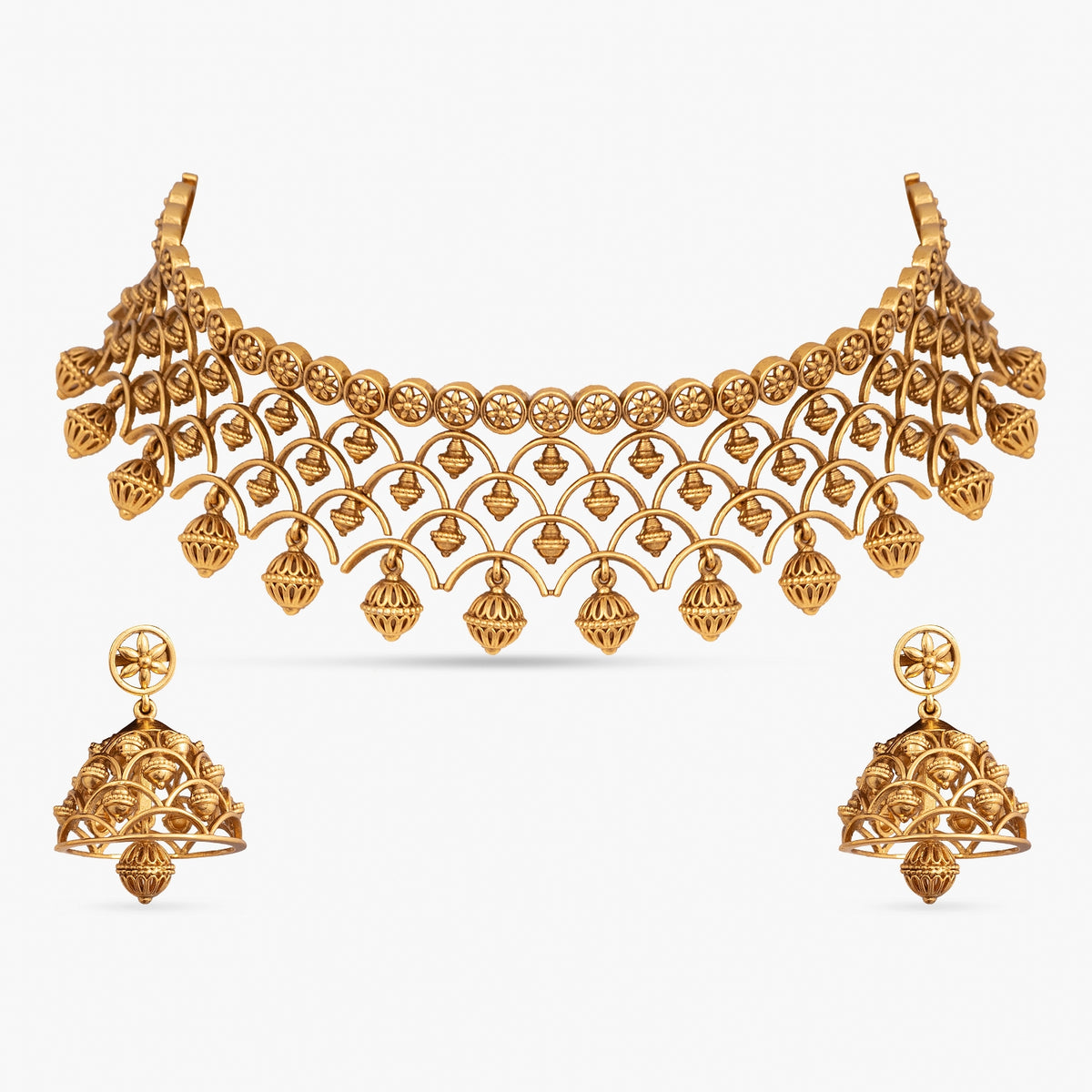 Indian gold jewelry set: choker necklace and earrings.