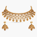 Indian gold jewelry set: choker necklace and earrings.