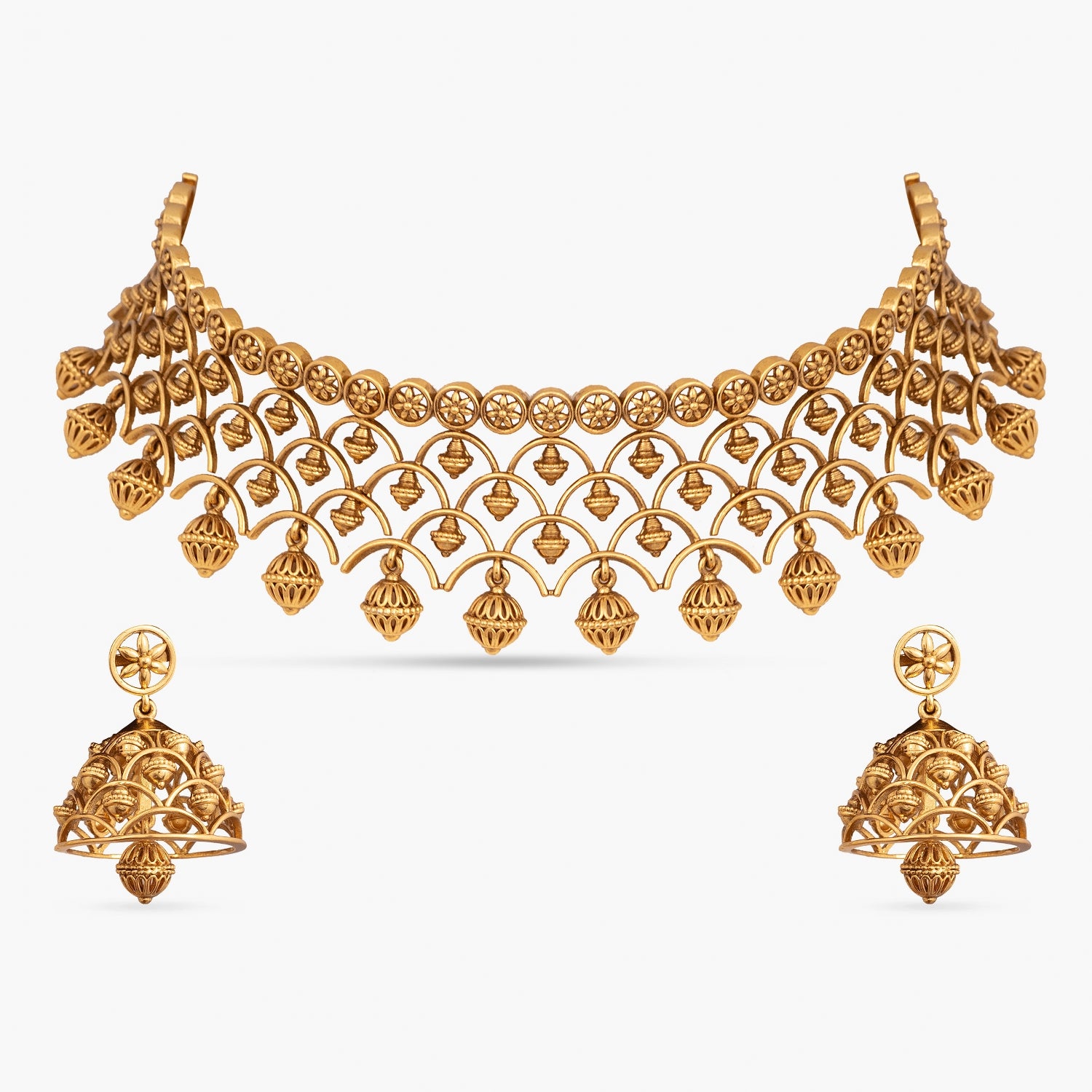Indian gold jewelry set: choker necklace and earrings.